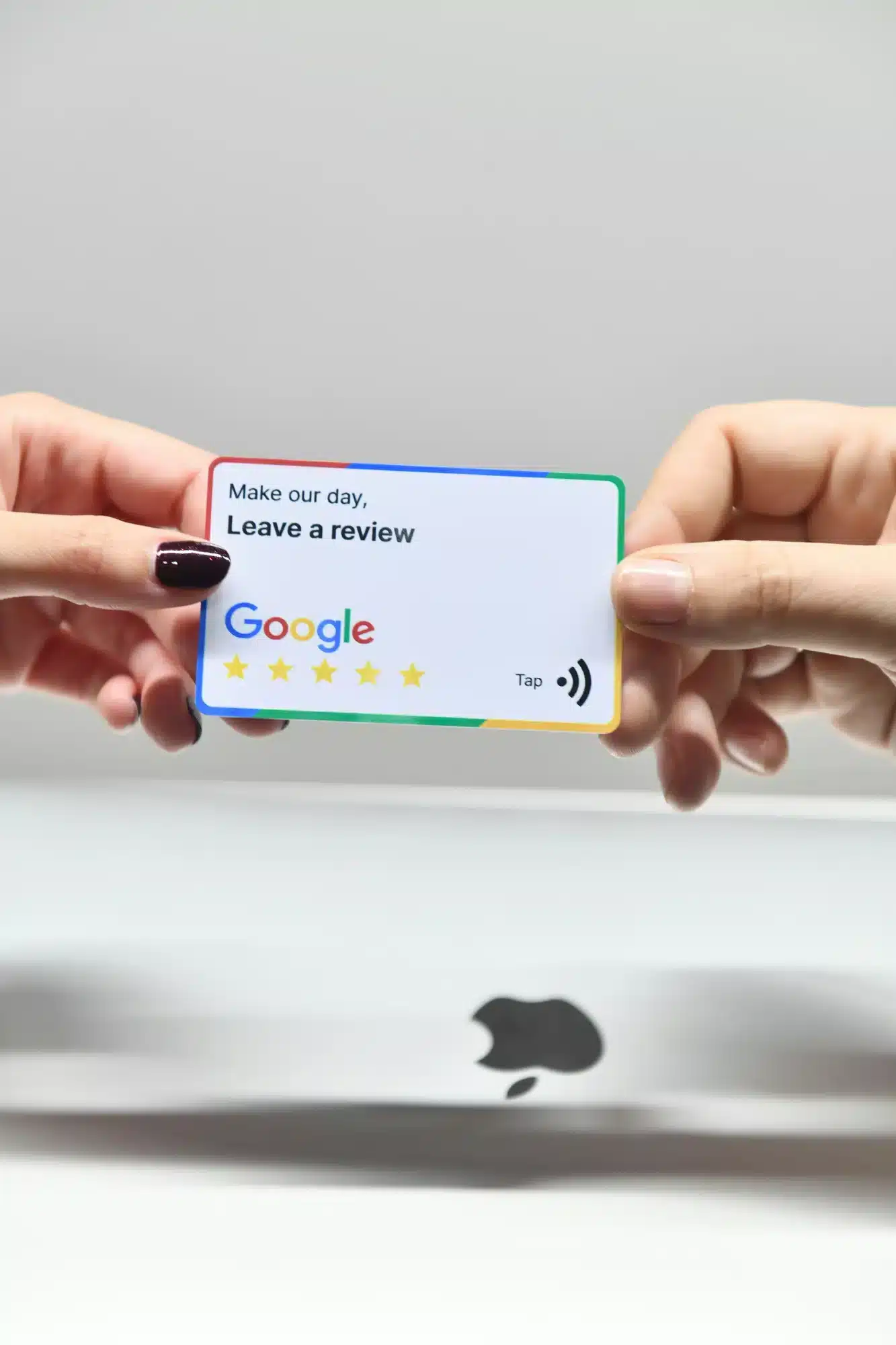 Two hands hold a Google review card that reads Make our day, Leave a review, featuring the Google logo and five stars.